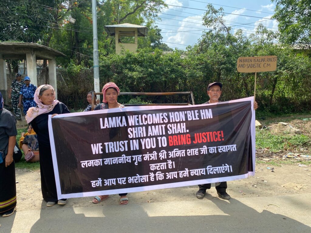Manipur locals welcoming Amit Shah with a banner