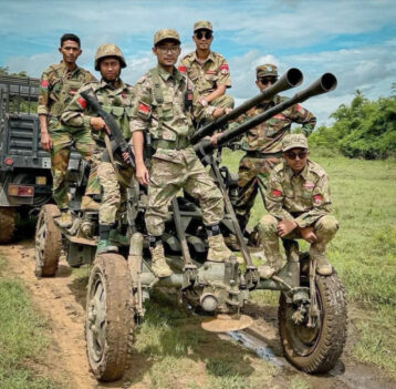 Soldiers of the Mandalay PDF with equipment they captured from one of the more than 30 junta camps they have seized in the past month.