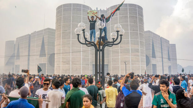 Protestors celebrating outside the Parliament in Dhaka (Photo: Indian Express)