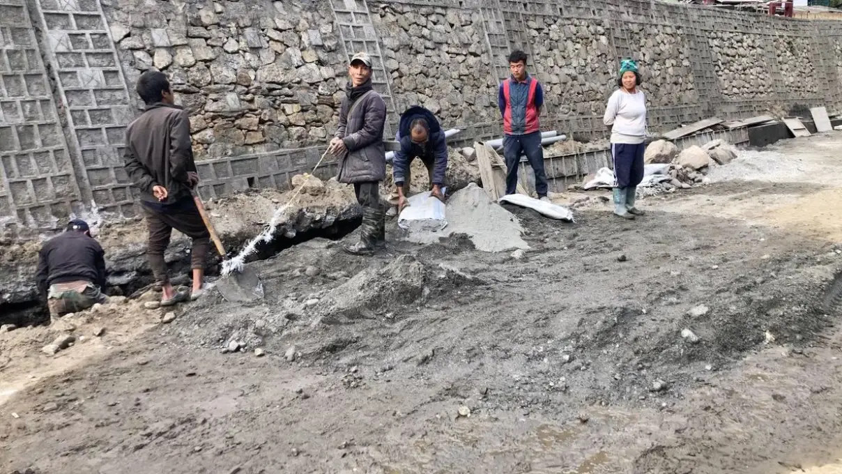 Locals helping with road construction work at Gelemo